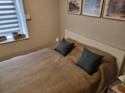 Łóżko lub łóżka w pokoju w obiekcie Apartament Pod jeleniem