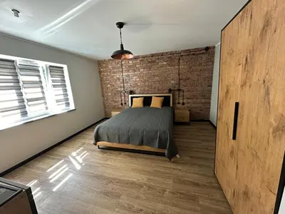 Łóżko lub łóżka w pokoju w obiekcie Apartament Stara cegła