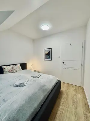 Łóżko lub łóżka w pokoju w obiekcie Lipowe Zacisze
