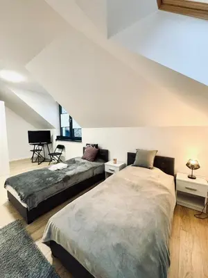 Łóżko lub łóżka w pokoju w obiekcie Lipowe Zacisze