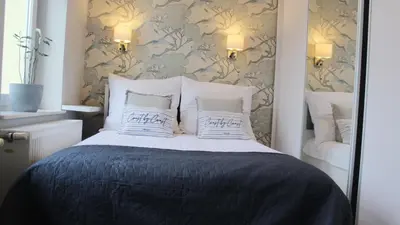 Łóżko lub łóżka w pokoju w obiekcie AP Apartment's Zielony