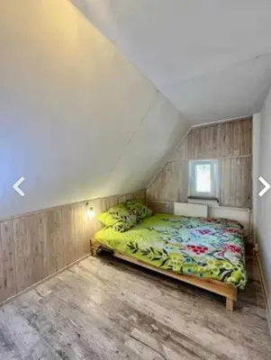 Łóżko lub łóżka w pokoju w obiekcie Apartament Wilk