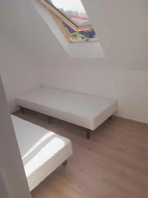 Łóżko lub łóżka w pokoju w obiekcie Apartament Wilk
