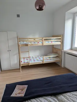 Łóżko lub łóżka w pokoju w obiekcie Apartament po Stronie gór - stoki narciarskie, kąpielisko, trasy rowerowe