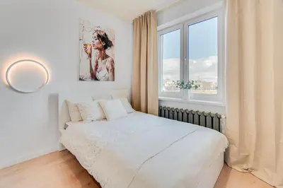 Łóżko lub łóżka w pokoju w obiekcie COMFISTAY Plac Piłsudskiego 8 - Rynek i Amfiteatr