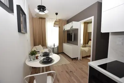 Telewizja i/lub zestaw kina domowego w obiekcie Apartamenty K netflix wi-fi