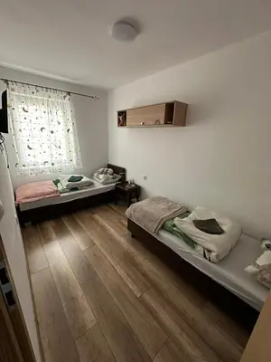 Łóżko lub łóżka w pokoju w obiekcie Apartament Zaciszny Kącik