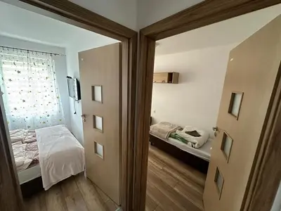 Łóżko lub łóżka w pokoju w obiekcie Apartament Zaciszny Kącik