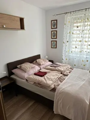 Łóżko lub łóżka w pokoju w obiekcie Apartament Zaciszny Kącik