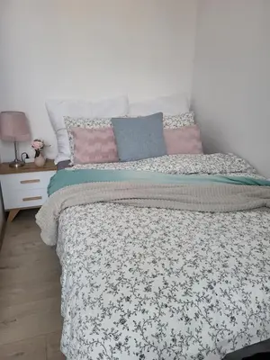 Łóżko lub łóżka w pokoju w obiekcie Apartament - Studio 5 Gliwice
