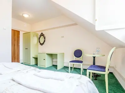 Łóżko lub łóżka w pokoju w obiekcie Hotel Magiczny Zakątek