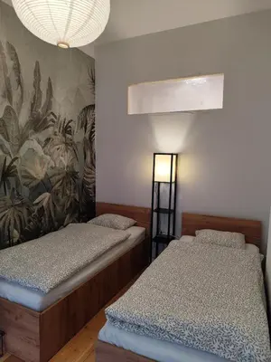 Łóżko lub łóżka w pokoju w obiekcie Apartament ZIELONY Legnica