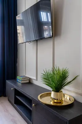Telewizja i/lub zestaw kina domowego w obiekcie Neon 45 Apartment - ProperUNIT