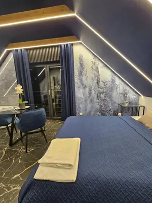 Łóżko lub łóżka w pokoju w obiekcie Blue Love