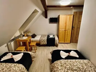 Łóżko lub łóżka w pokoju w obiekcie Noclegi Pocztowa 1