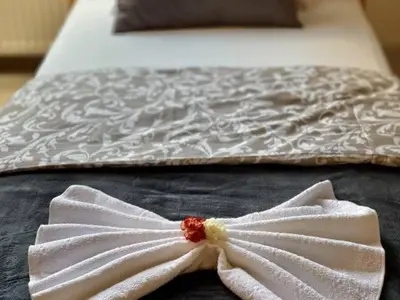 Łóżko lub łóżka w pokoju w obiekcie Noclegi Pocztowa 1