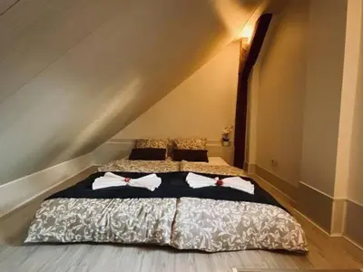 Łóżko lub łóżka w pokoju w obiekcie Noclegi Pocztowa 1