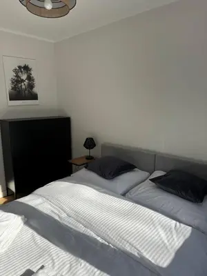 Łóżko lub łóżka w pokoju w obiekcie Apartament Malczewskiego 3