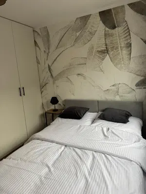 Łóżko lub łóżka w pokoju w obiekcie Apartament Malczewskiego 3