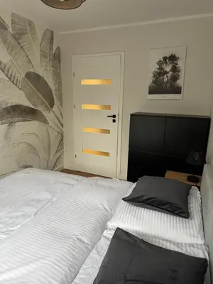 Łóżko lub łóżka w pokoju w obiekcie Apartament Malczewskiego 3