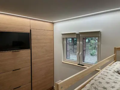 Łóżko lub łóżka w pokoju w obiekcie Leśne Zacisze Kawice
