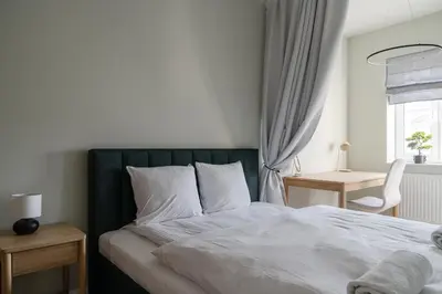 Łóżko lub łóżka w pokoju w obiekcie RentPlanet - Apartament Jęczmienna