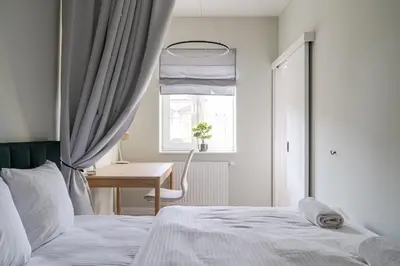 Łóżko lub łóżka w pokoju w obiekcie RentPlanet - Apartament Jęczmienna