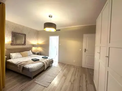 Łóżko lub łóżka w pokoju w obiekcie Apartament Centrum Krawiecka Rynek