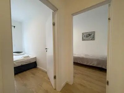Łóżko lub łóżka w pokoju w obiekcie APARTAMENT POLANICA RESIDENCE Nr 1