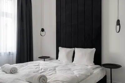 Łóżko lub łóżka w pokoju w obiekcie RentPlanet - Apartamenty Włodkowica