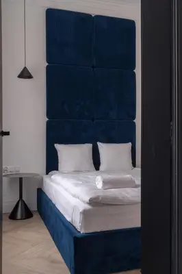 Łóżko lub łóżka w pokoju w obiekcie RentPlanet - Apartamenty Włodkowica