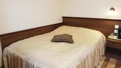 Łóżko lub łóżka w pokoju w obiekcie Pokoje Gościnne Akacja