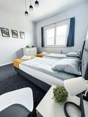 Łóżko lub łóżka w pokoju w obiekcie Skandi
