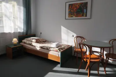 Łóżko lub łóżka w pokoju w obiekcie Dom Studencki Labirynt
