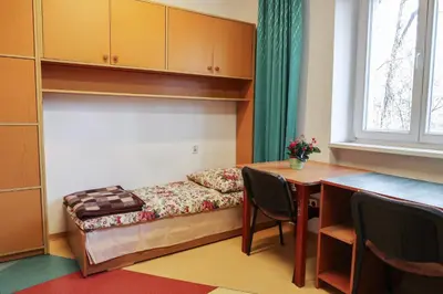 Łóżko lub łóżka w pokoju w obiekcie Dom Studencki Labirynt