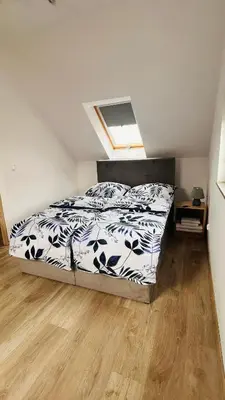 Łóżko lub łóżka w pokoju w obiekcie Apartament - DOMEK CAŁOROCZNY JESIONOWSCY sauna