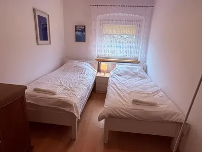 Łóżko lub łóżka w pokoju w obiekcie Apartament Złota Woda