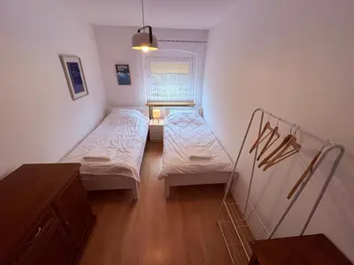 Łóżko lub łóżka w pokoju w obiekcie Apartament Złota Woda