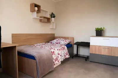 Łóżko lub łóżka w pokoju w obiekcie Dom Studencki Arka