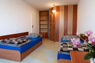Łóżko lub łóżka w pokoju w obiekcie Dom Studencki Raj