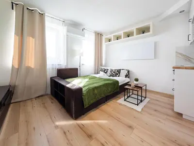 Łóżko lub łóżka w pokoju w obiekcie Park Grabiszyński Standard Studio by BookingHost