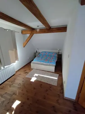 Łóżko lub łóżka w pokoju w obiekcie Stara Plebania