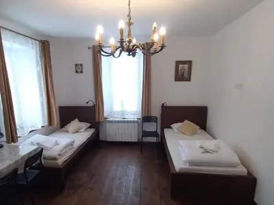 Łóżko lub łóżka w pokoju w obiekcie Stara Plebania