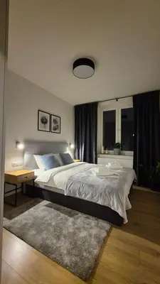 Łóżko lub łóżka w pokoju w obiekcie Apart Krakowska 41
