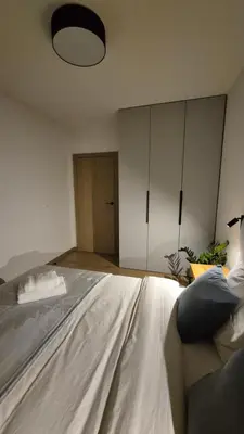 Łóżko lub łóżka w pokoju w obiekcie Apart Krakowska 41
