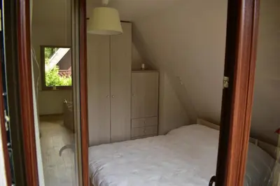 Łóżko lub łóżka w pokoju w obiekcie Sulistrowiczki Kwiatowa 3