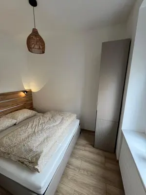 Łóżko lub łóżka w pokoju w obiekcie Apartament Kaszmir