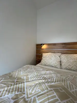 Łóżko lub łóżka w pokoju w obiekcie Apartament Kaszmir