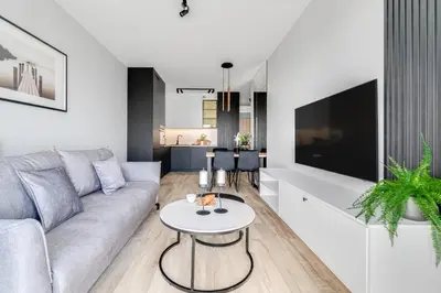 Telewizja i/lub zestaw kina domowego w obiekcie Rent Invest - Quorum Apartamenty Parking Klimatyzacja