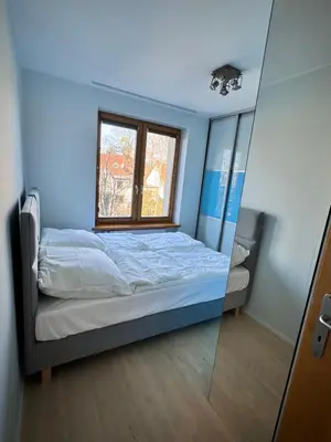 Łóżko lub łóżka w pokoju w obiekcie Rybak30